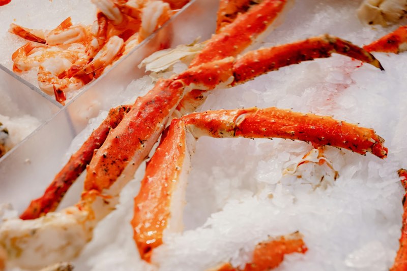 Crab legs piled on ice