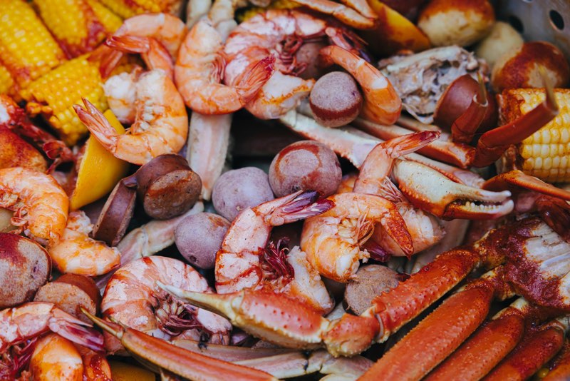 Seafood boil with shrimp, crab legs, clams and corn
