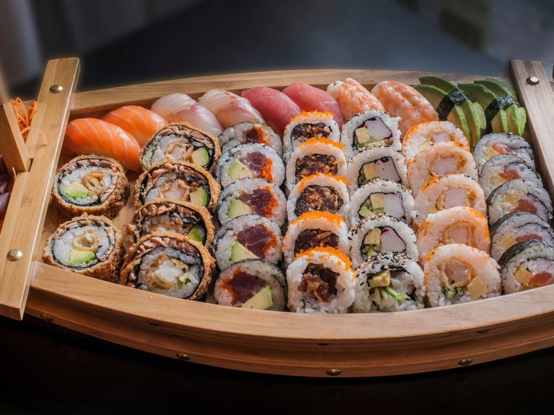 Sushi boat with assorted rolls